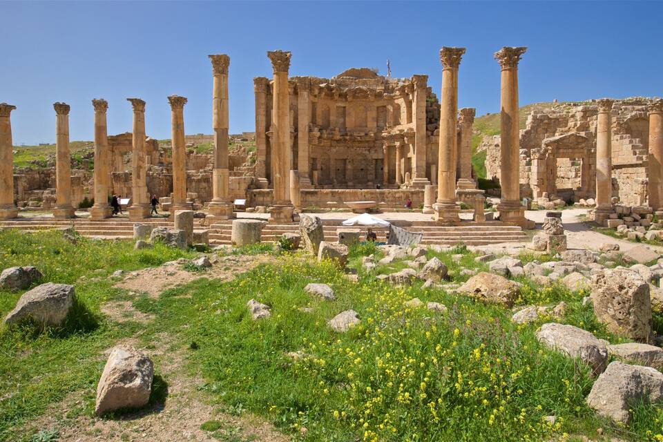 Ancient ruins with columns and stone structures.