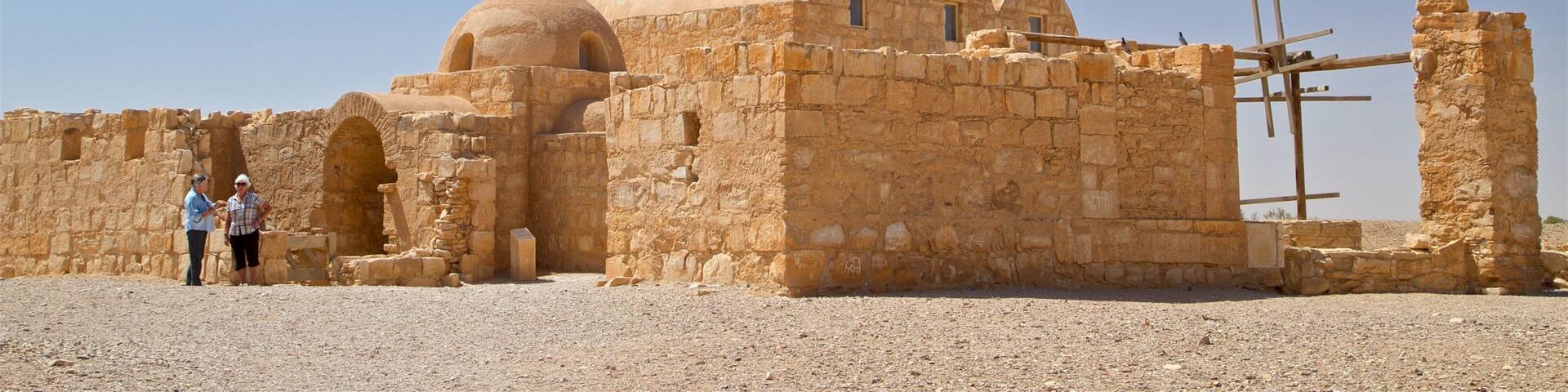 Quseir Amra showing desert views and heritage elements as well as a couple