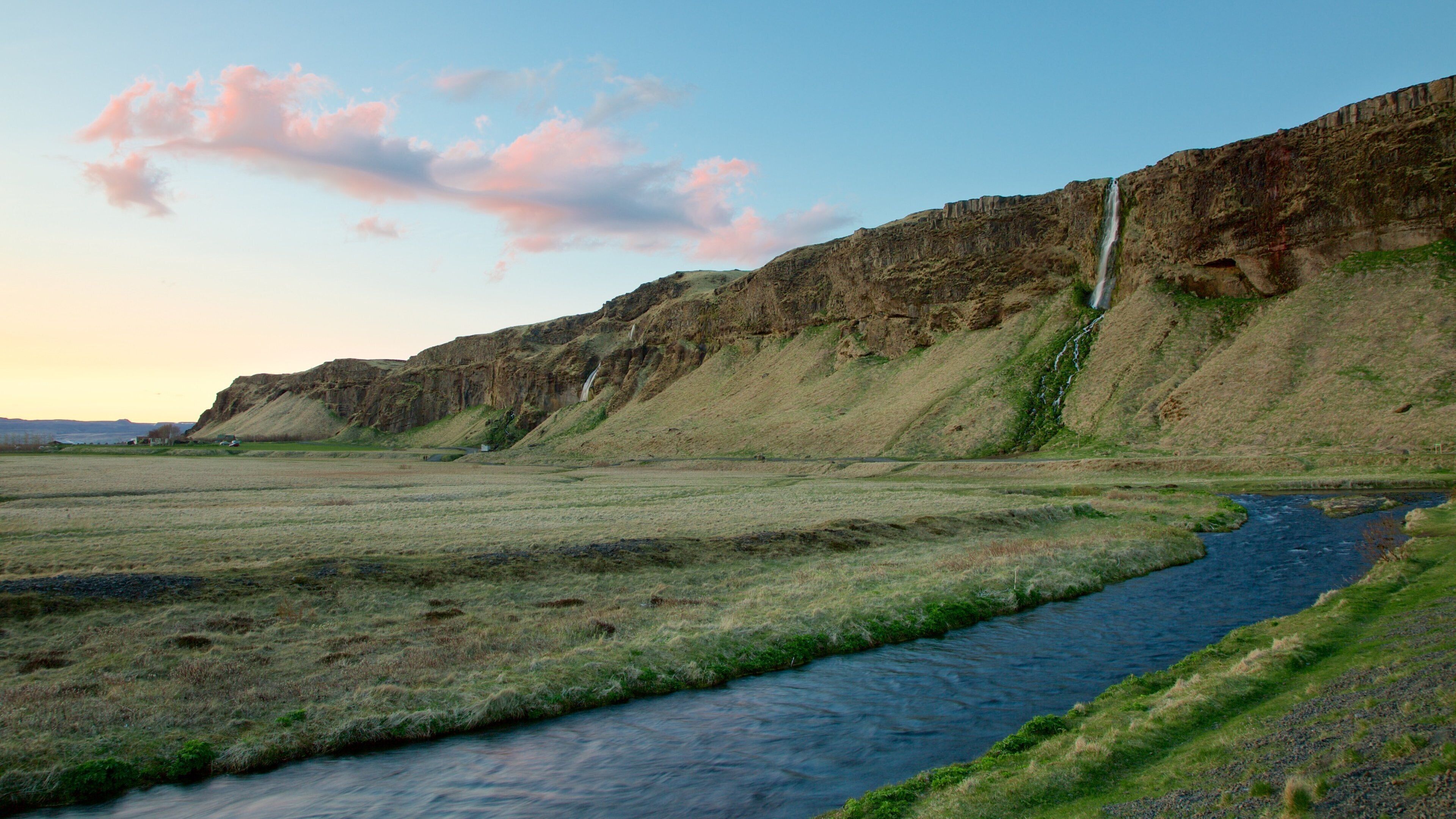 Seljalandsfoss showing mountains, tranquil scenes and a river or creek