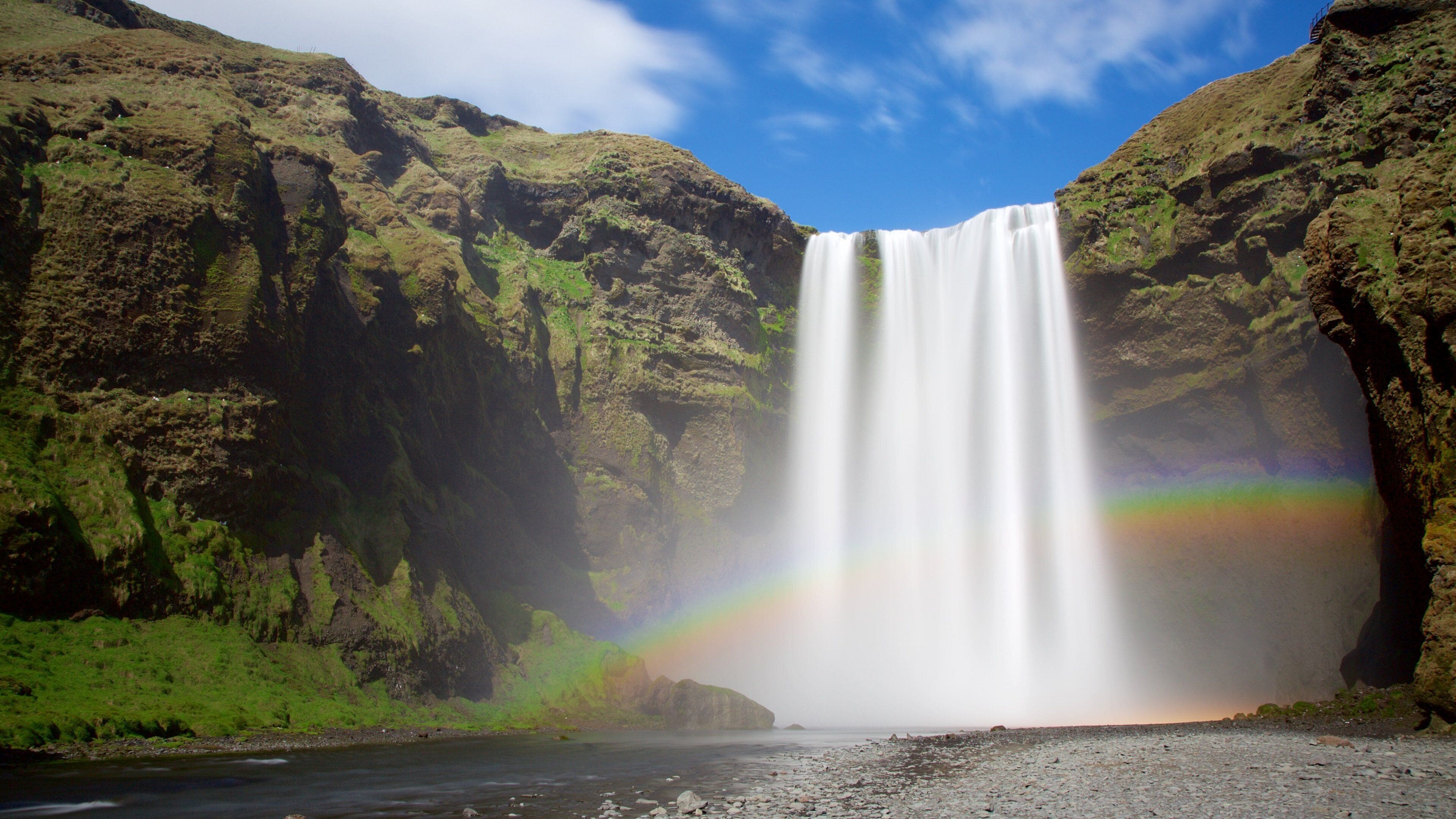 Skogafoss featuring a waterfall and a gorge or canyon