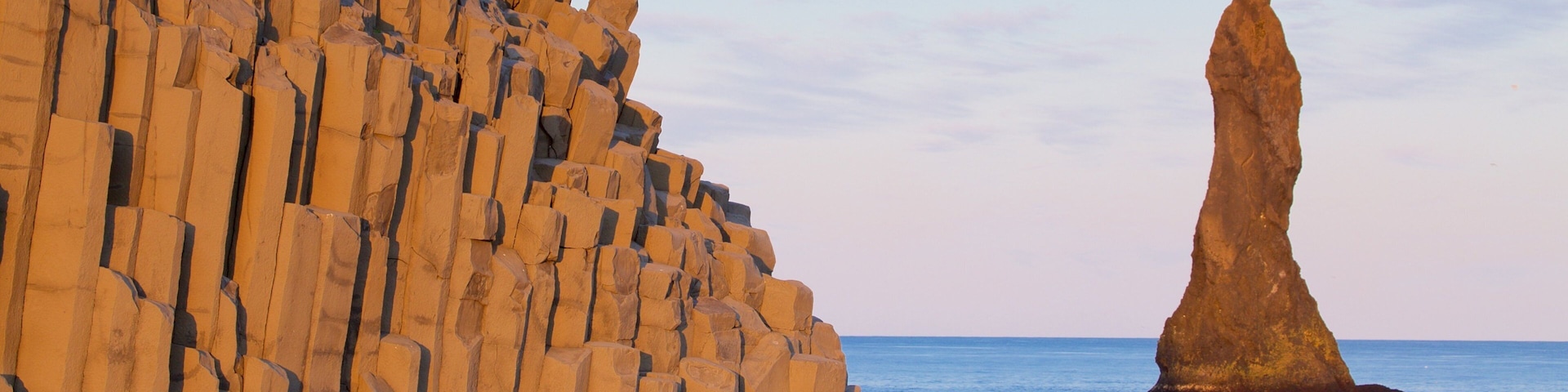 Reynisdrangar showing a sunset and general coastal views