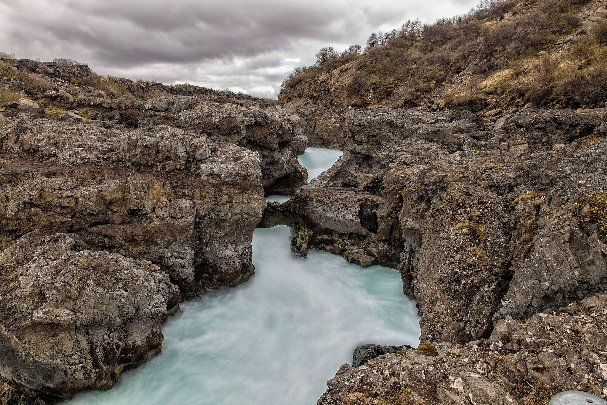 In the middle is children's bridge and waterfall. A few hundred years ago two children were walking across a natural bridge and fell. The mother paid men to break the bridge after so no other children would fall. The only part left is what you see here. 