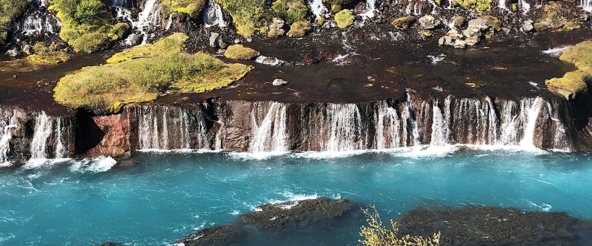 Quick and easy detour on your way to Into the Glacier tours. Bright blue water gushing out of lava!