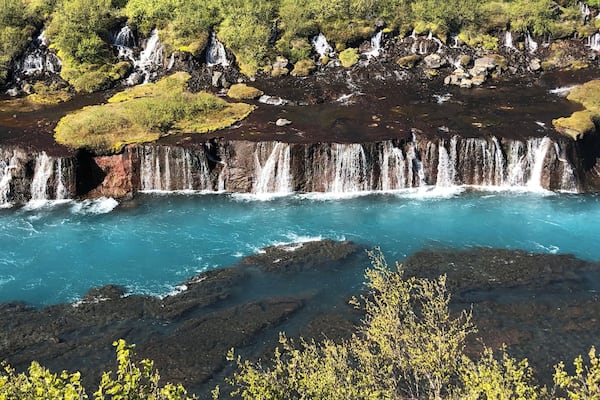 Quick and easy detour on your way to Into the Glacier tours. Bright blue water gushing out of lava!