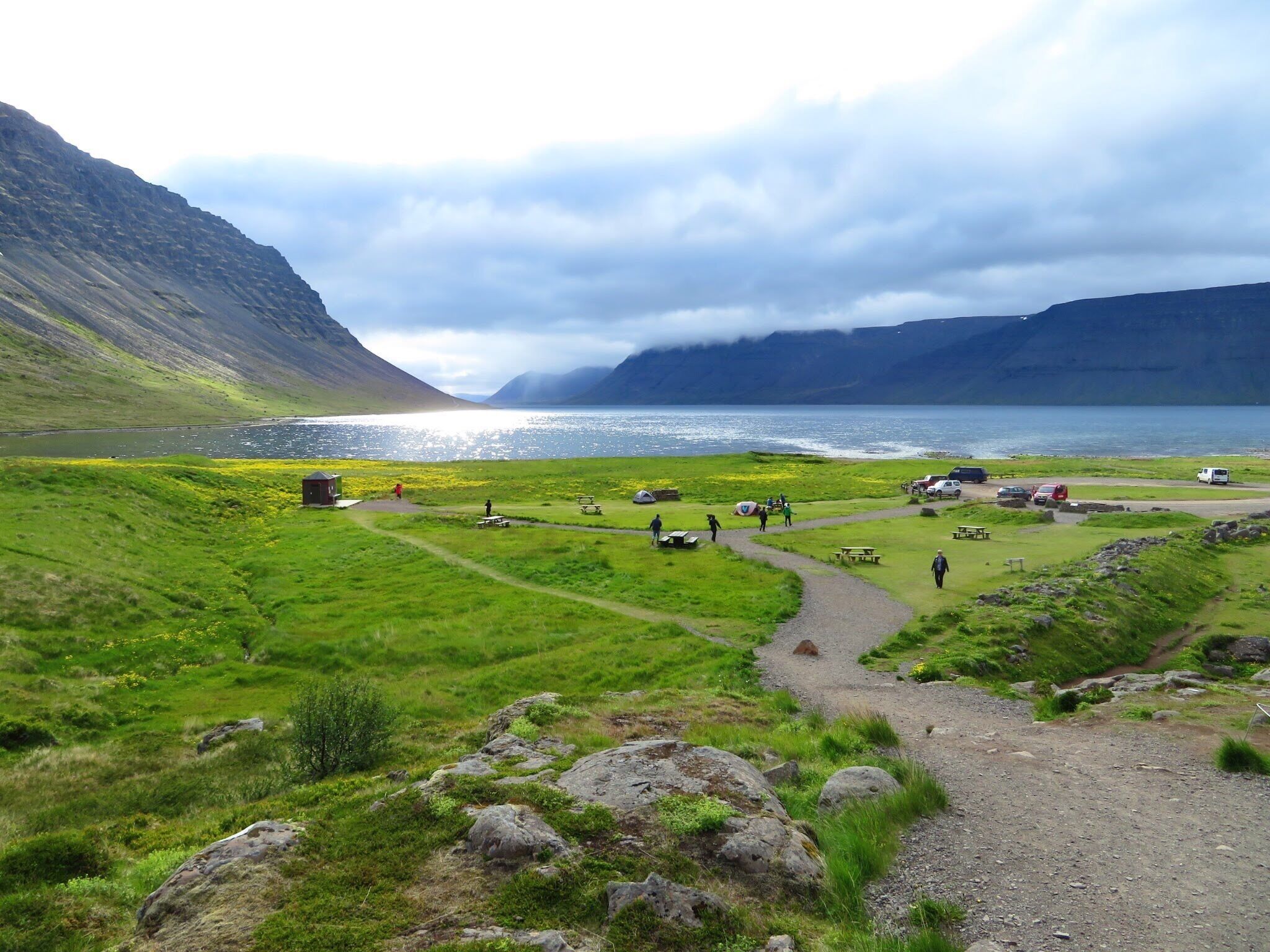 Dynjandi waterfalls are a magnificent sight and is the most commonly visited place for tourists visiting Iceland. This view of the Atlantic ocean opposite to the waterfalls is just as serene as the waterfalls itself. The midnight sun at the horizon is just once a lifetime experience that no one should ever miss if you happen to visit Iceland, the land of Fire and Ice!