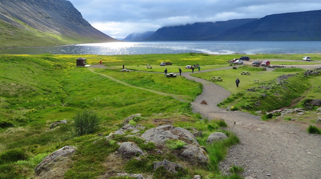 Dynjandi waterfalls are a magnificent sight and is the most commonly visited place for tourists visiting Iceland. This view of the Atlantic ocean opposite to the waterfalls is just as serene as the waterfalls itself. The midnight sun at the horizon is just once a lifetime experience that no one should ever miss if you happen to visit Iceland, the land of Fire and Ice!