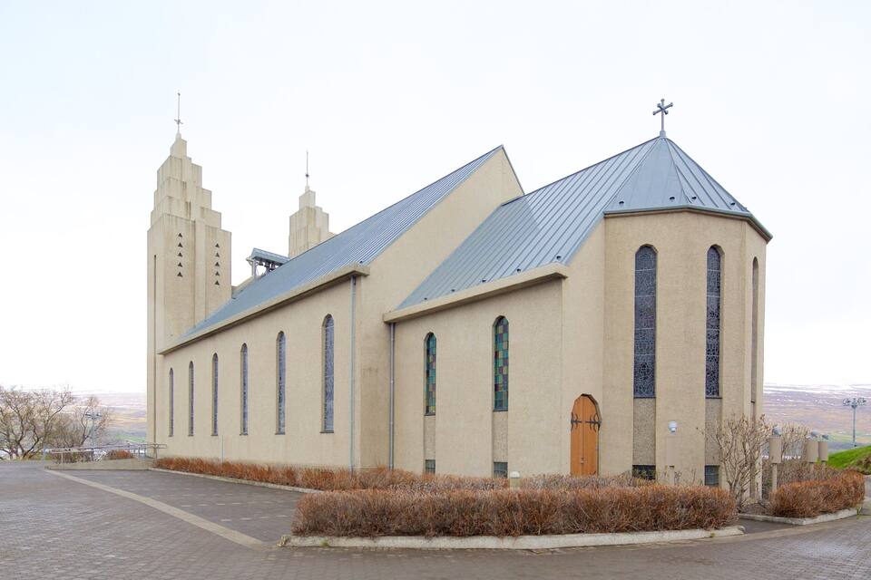 A church with a steep roof and two towers.