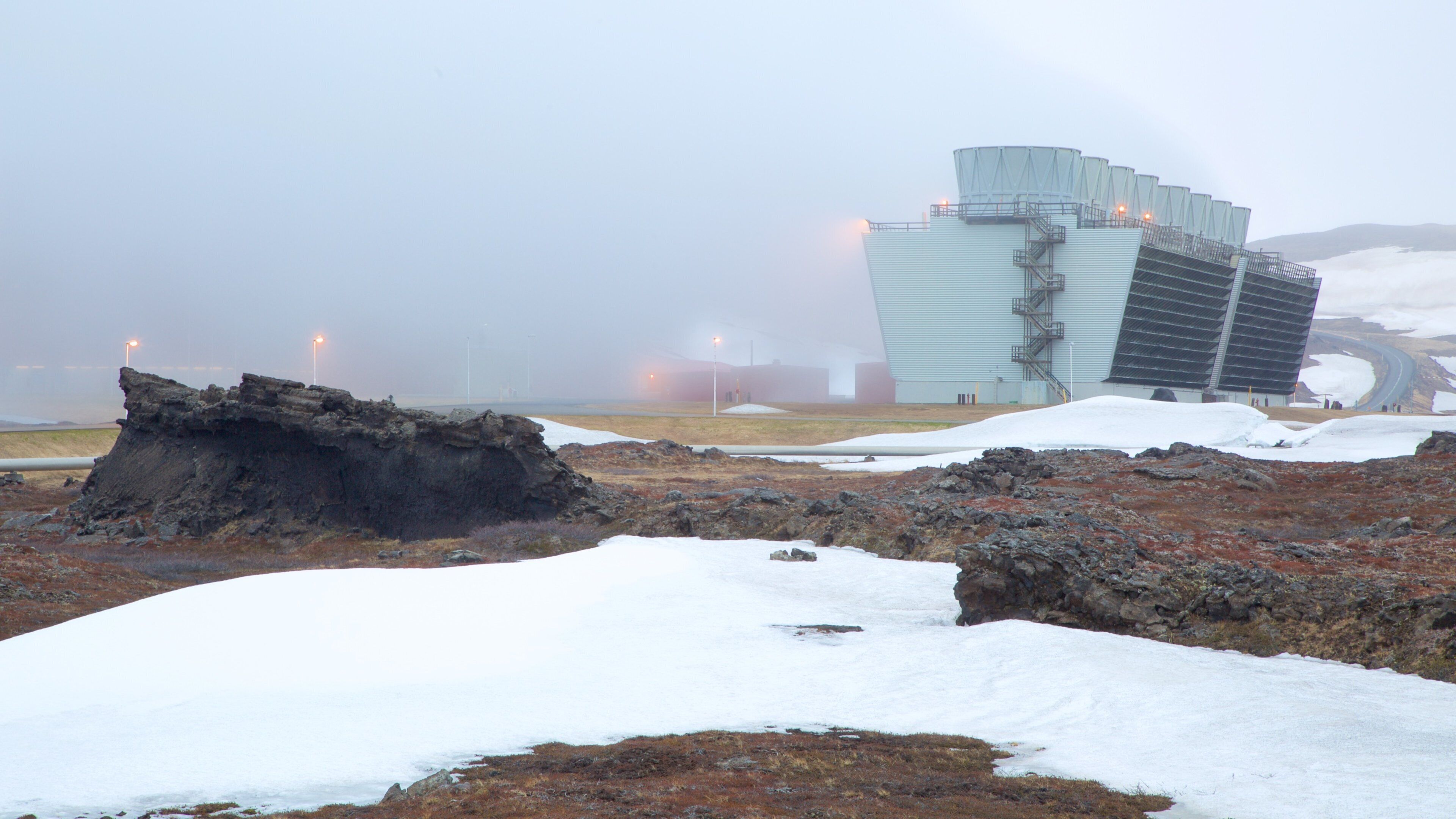 Krafla Volcano showing industrial elements, mist or fog and snow