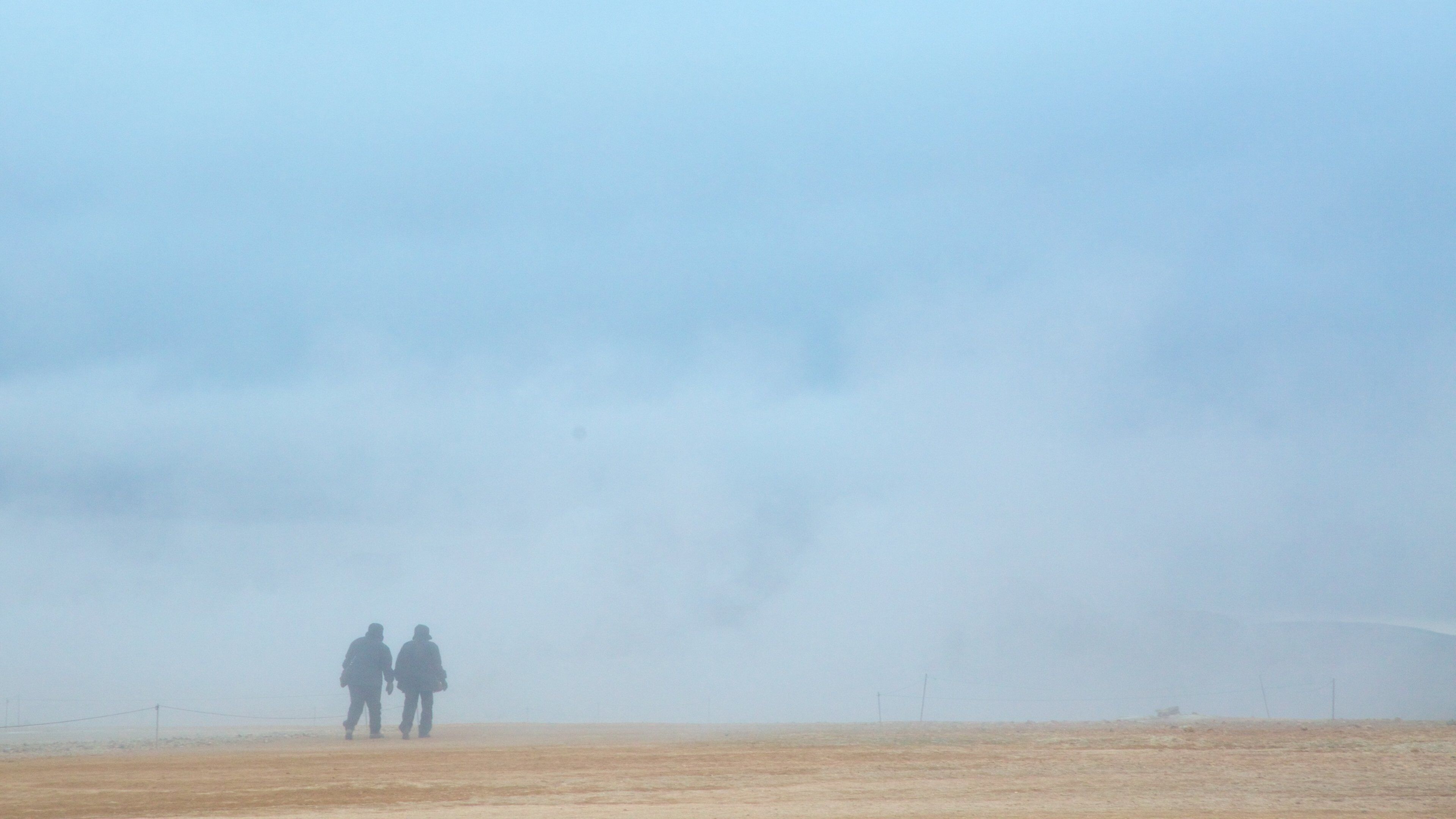 Namafjall featuring mist or fog as well as a couple