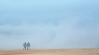 Namafjall featuring mist or fog as well as a couple