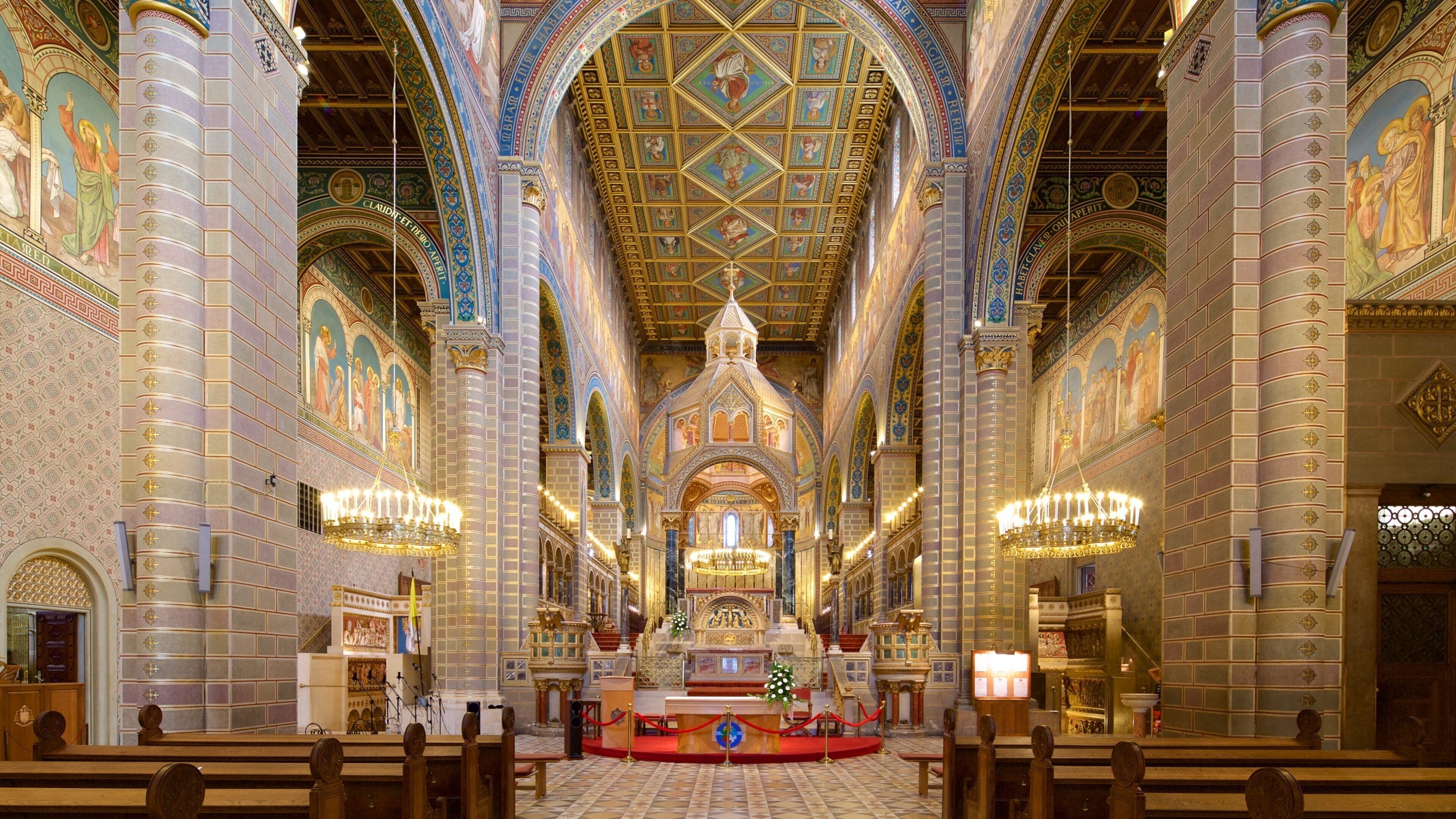 A grand cathedral interior with ornate ceilings, detailed mosaics, and a central altar.