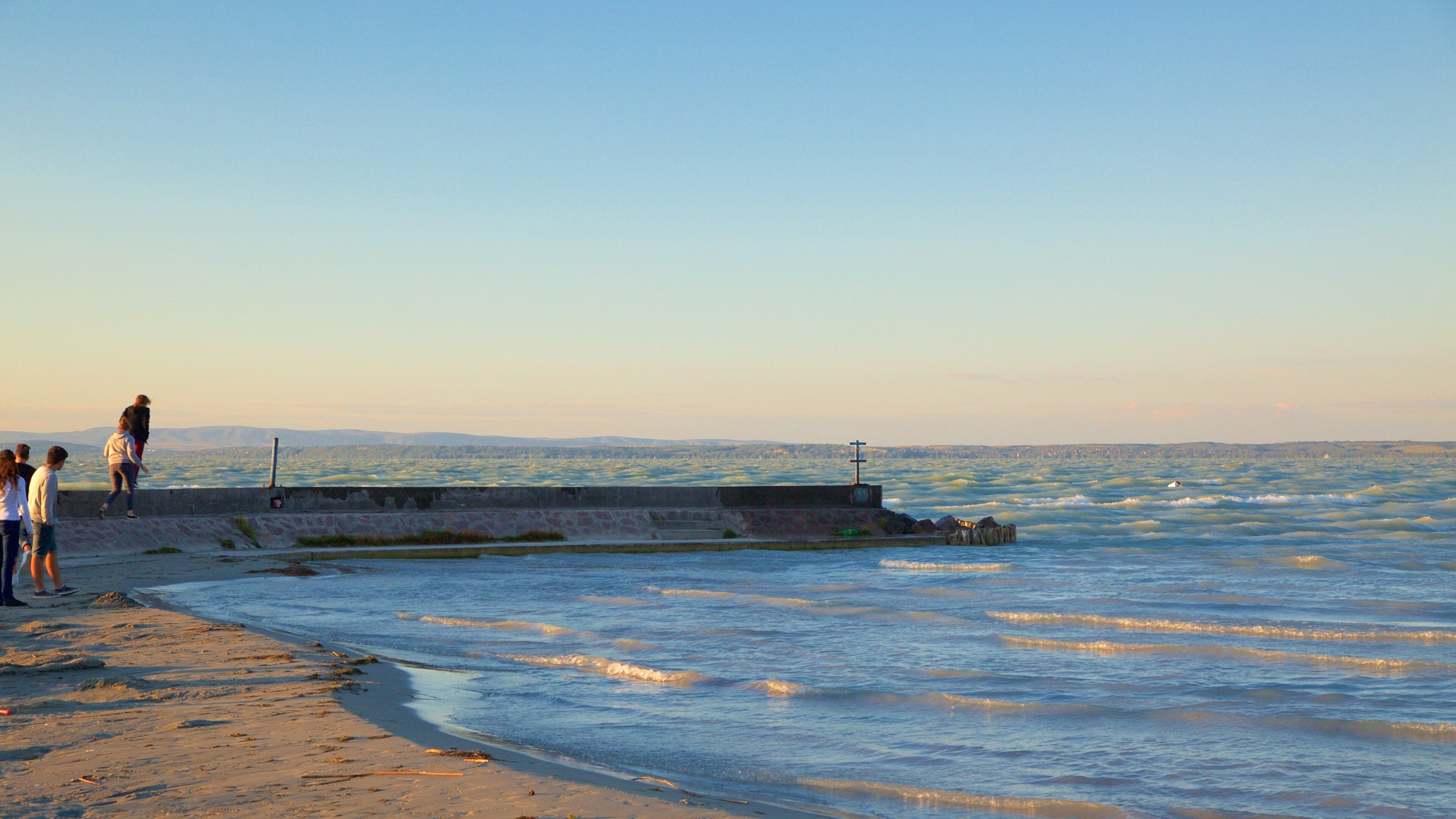 Golden Shore which includes a sunset, views and a sandy beach