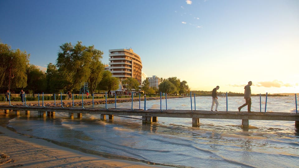 Golden Shore featuring views, a sandy beach and a sunset