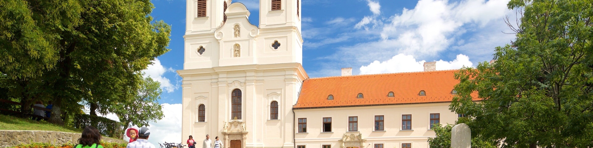 Tihany Abbey showing heritage architecture and a church or cathedral as well as a couple