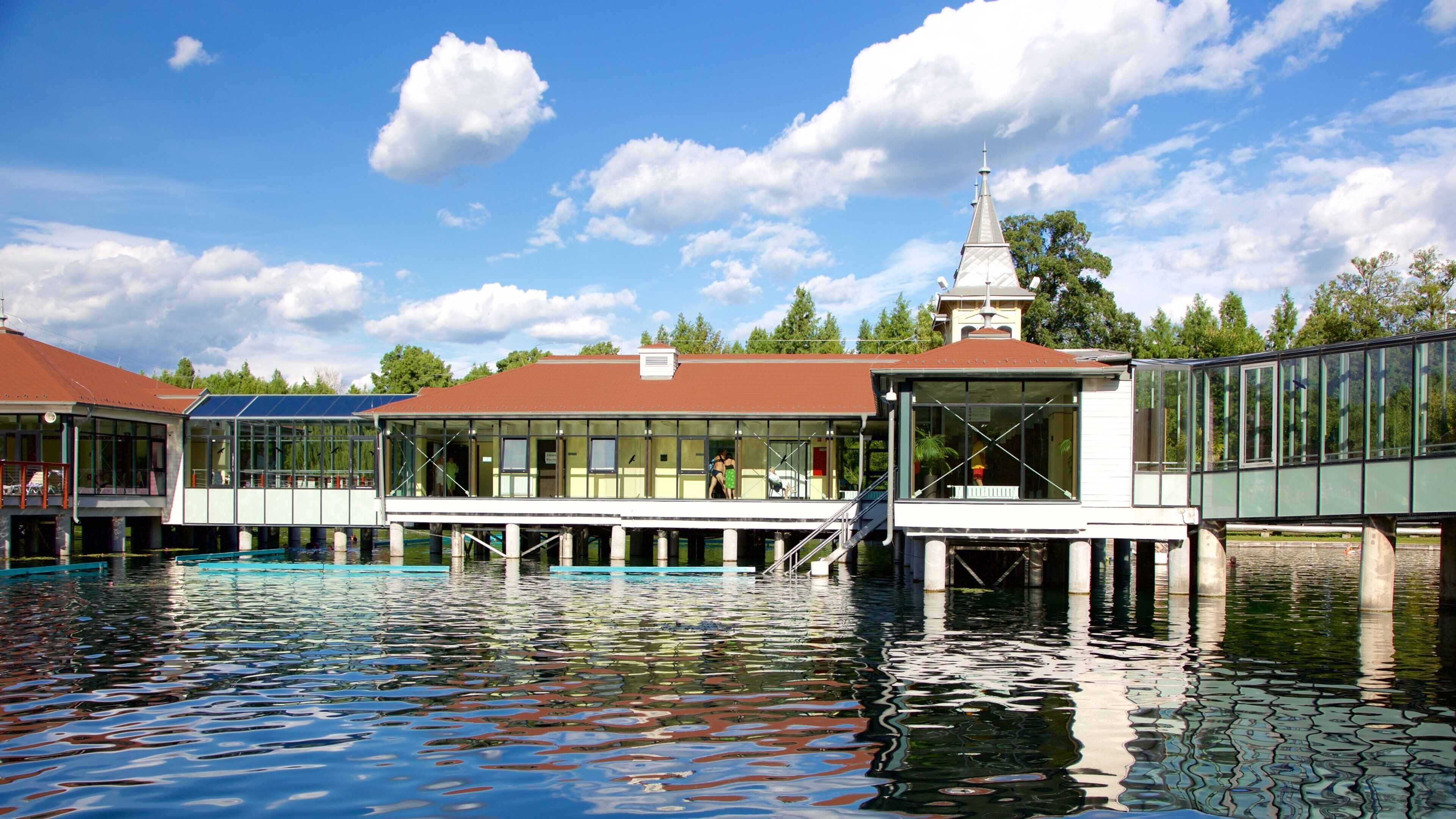 Lake Heviz which includes a lake or waterhole and a luxury hotel or resort