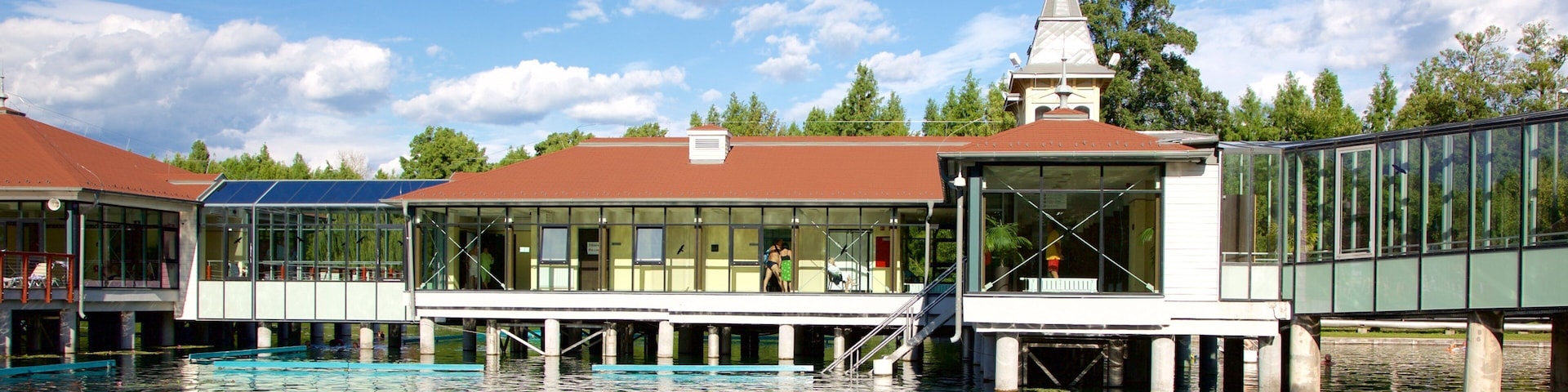 Lake Heviz which includes a lake or waterhole and a luxury hotel or resort