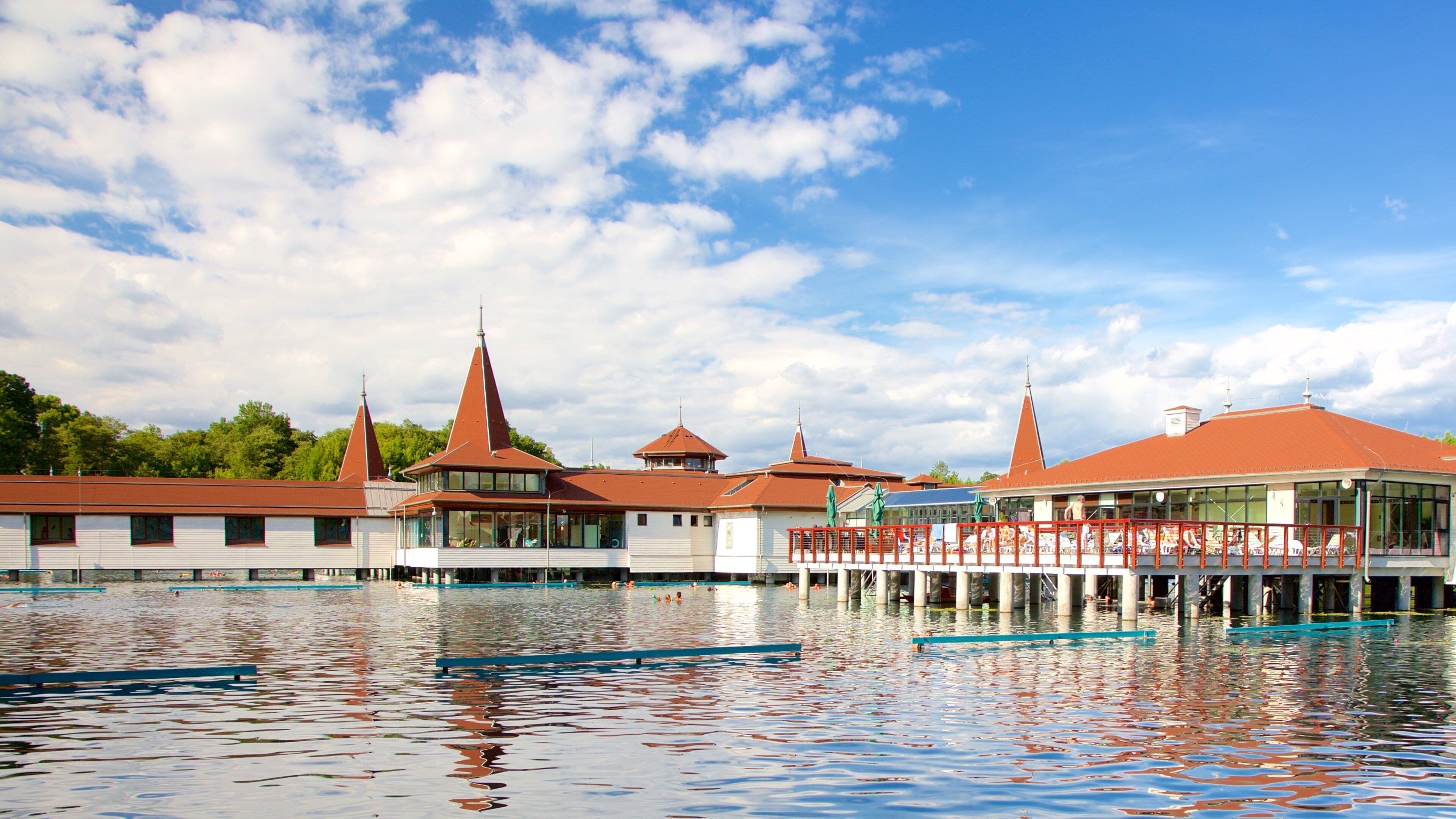 Lake Heviz which includes a lake or waterhole and a luxury hotel or resort