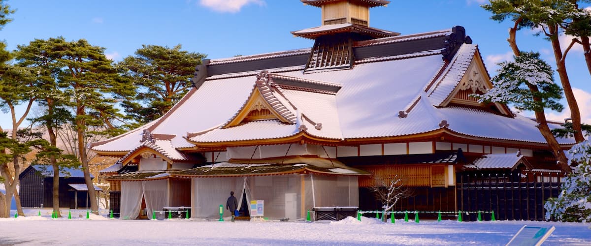 Fort Goryokaku which includes snow and a temple or place of worship
