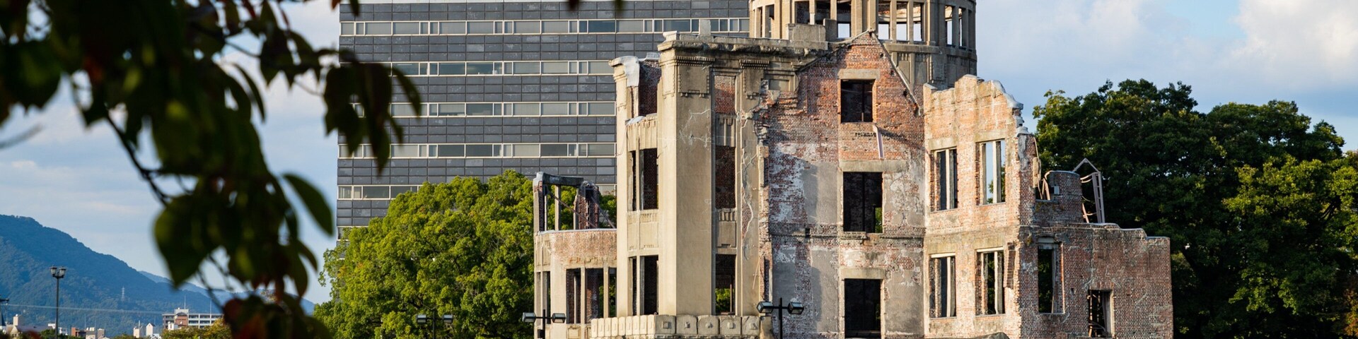 Atomic Bomb Dome which includes a ruin, a river or creek and heritage elements