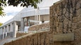 A stone wall with a sign for the Hiroshima City Museum of Contemporary Art.