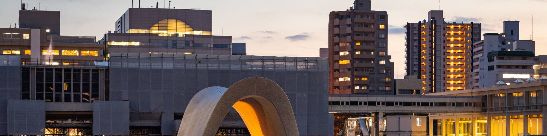 Hiroshima Peace Memorial Park featuring a sunset and a pond