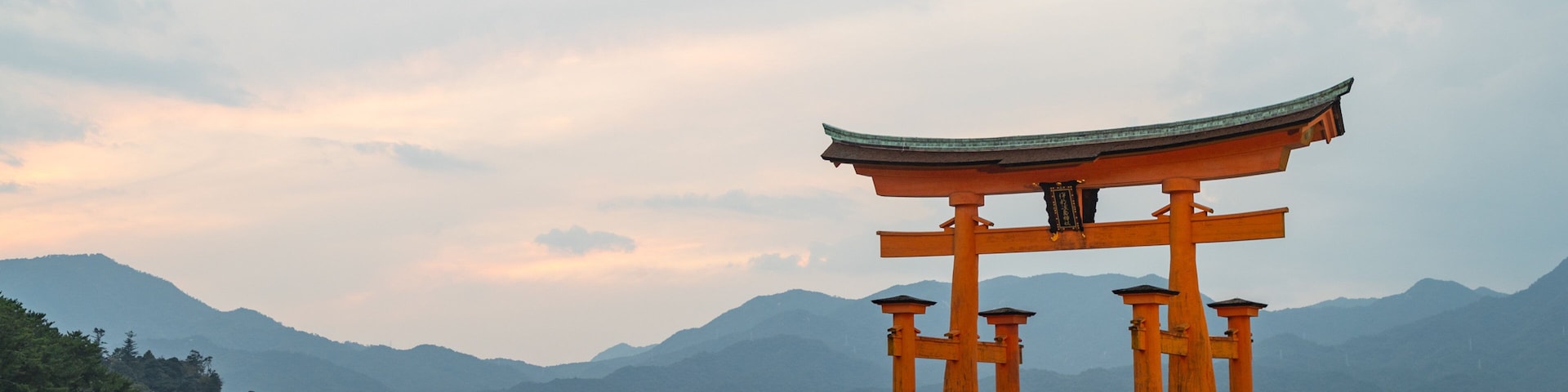 Itsukushima Shrine showing a sunset, heritage elements and a lake or waterhole
