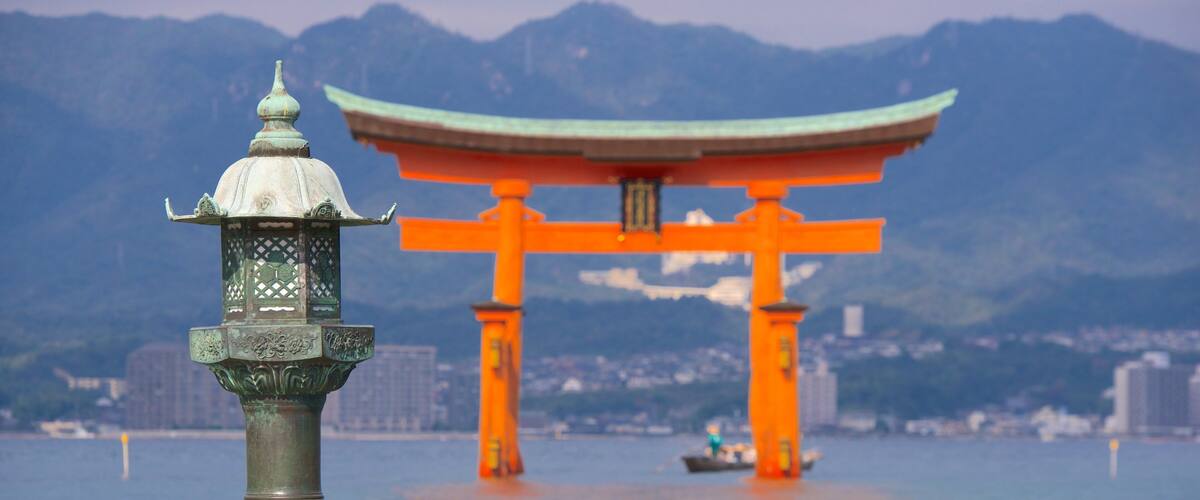 Itsukushima Shrine featuring a lake or waterhole and heritage elements