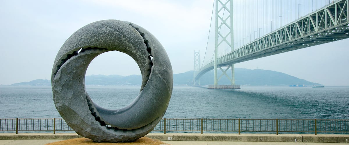 Akashi Kaikyo Bridge featuring a suspension bridge or treetop walkway, general coastal views and outdoor art