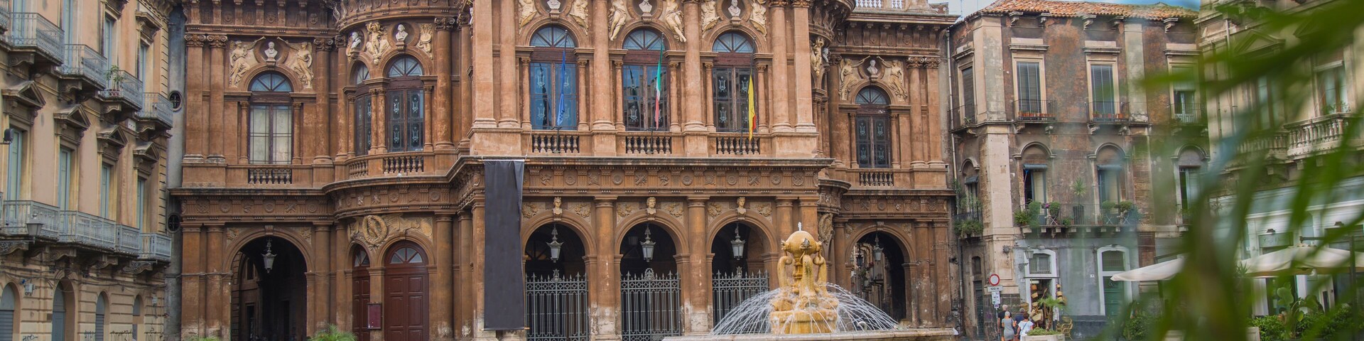 Theater and fountain on Piazza Vincenzo Bellini in Catania, Sicily, Italy. Teatro Massimo Bellini.; Shutterstock ID 736774237; purchase_order: Comps; job: ; client: ; other:
