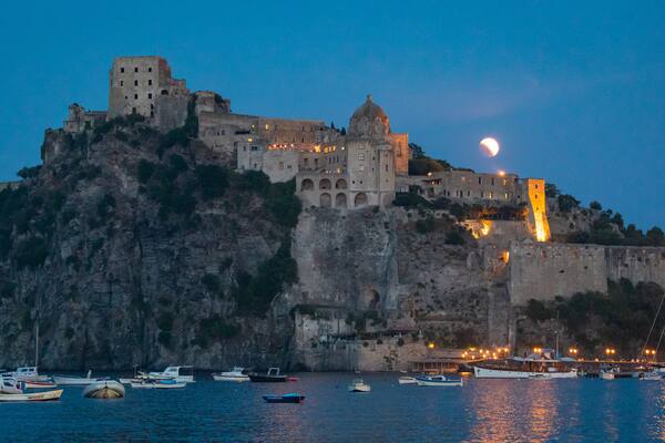 Aragonese Castle which includes general coastal views, night scenes and heritage elements