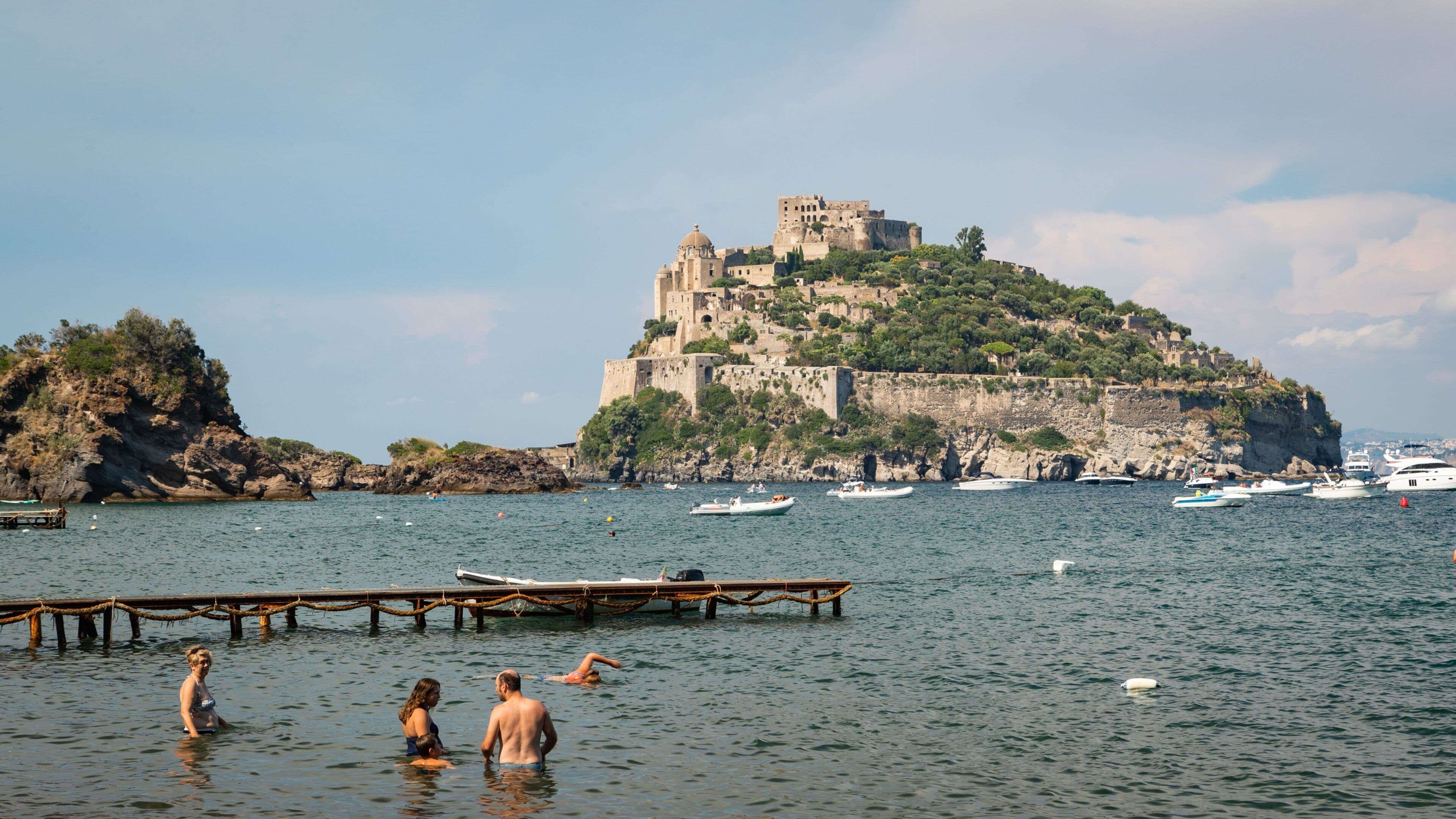 Cartaromana Beach featuring swimming, island views and a bay or harbor