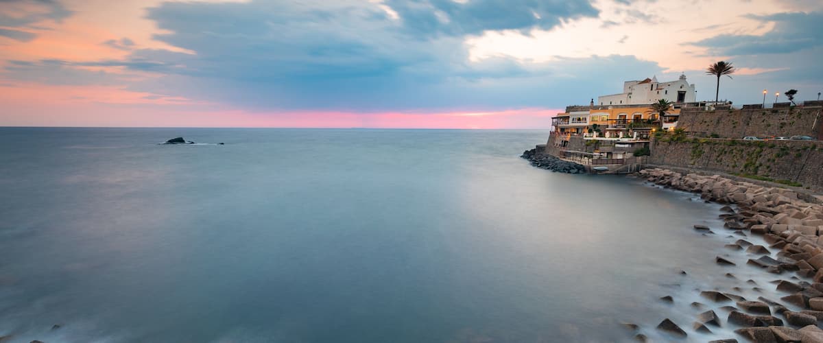 Soccorso Church which includes a sunset, landscape views and general coastal views