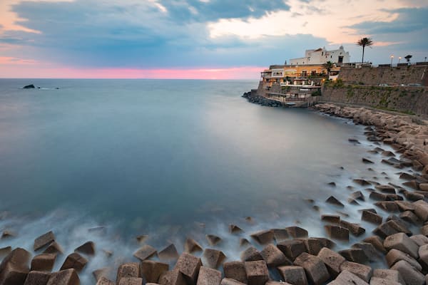 Soccorso Church which includes a sunset, landscape views and general coastal views