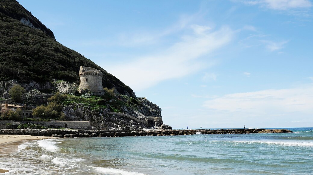 Horizontal banner or header with ancient defense tower Torre Paola on a hill near the Mediterranean Sea in the Circeo National Park. Coast of Lungomare di Sabaudia, Lazio region in central Italy.