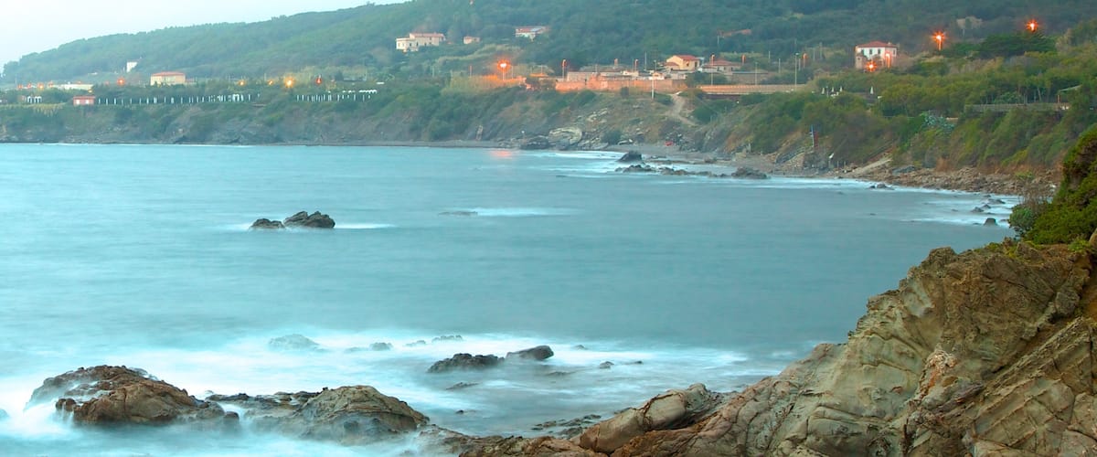 Castello del Boccale showing landscape views and rugged coastline