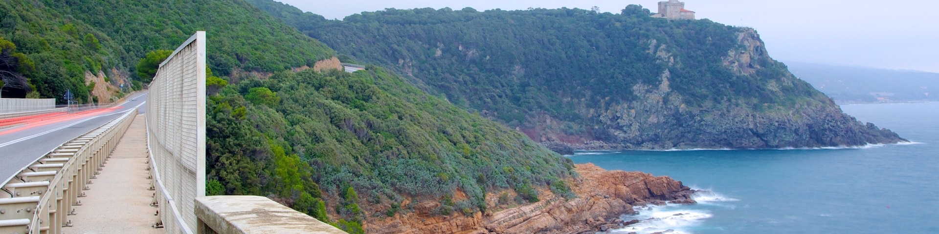 Castello Sonnino featuring rocky coastline
