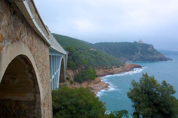 Castello Sonnino which includes heritage architecture, general coastal views and a bridge