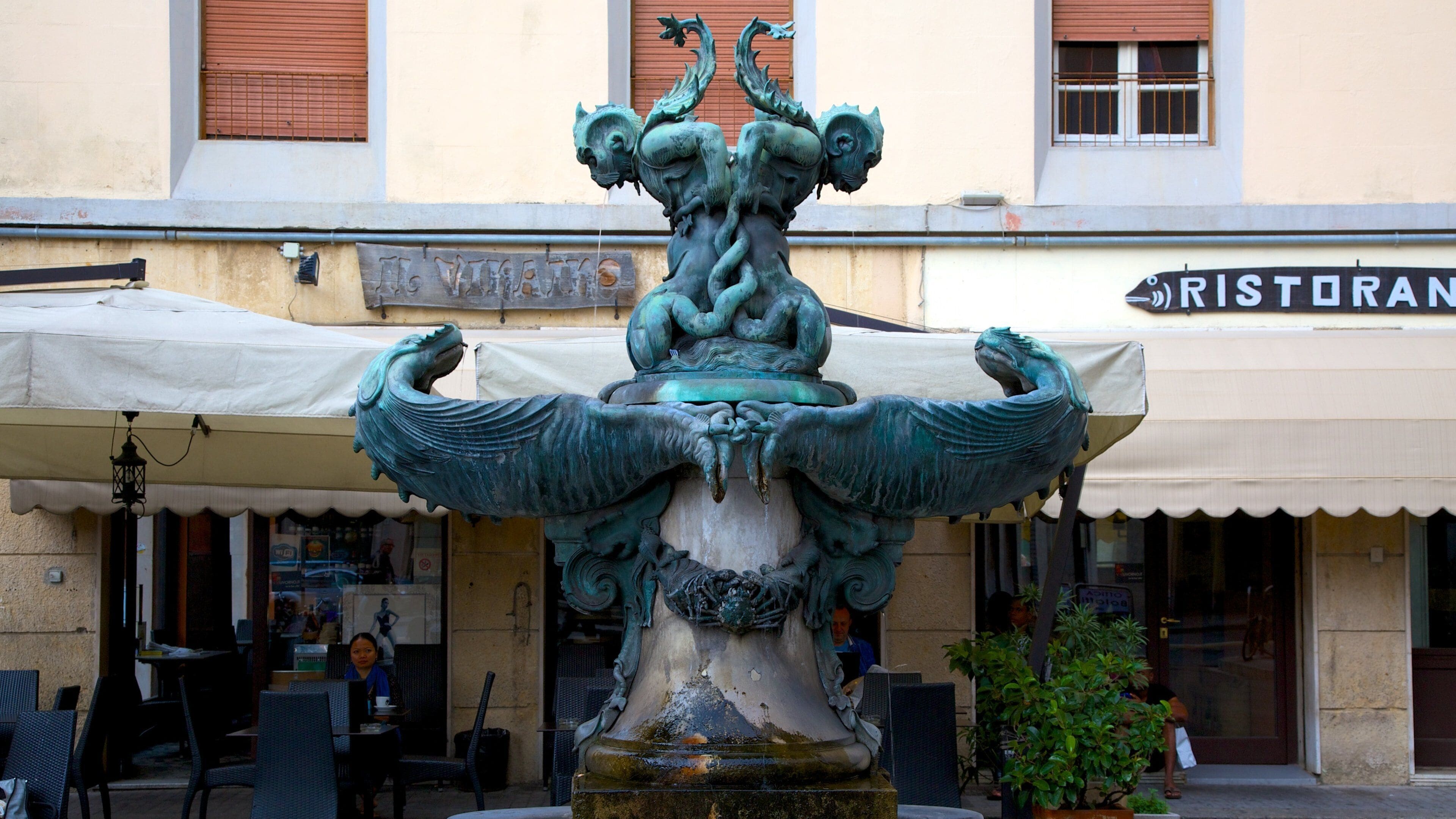 Monumento dei Quattro Mori showing outdoor art, a statue or sculpture and a city