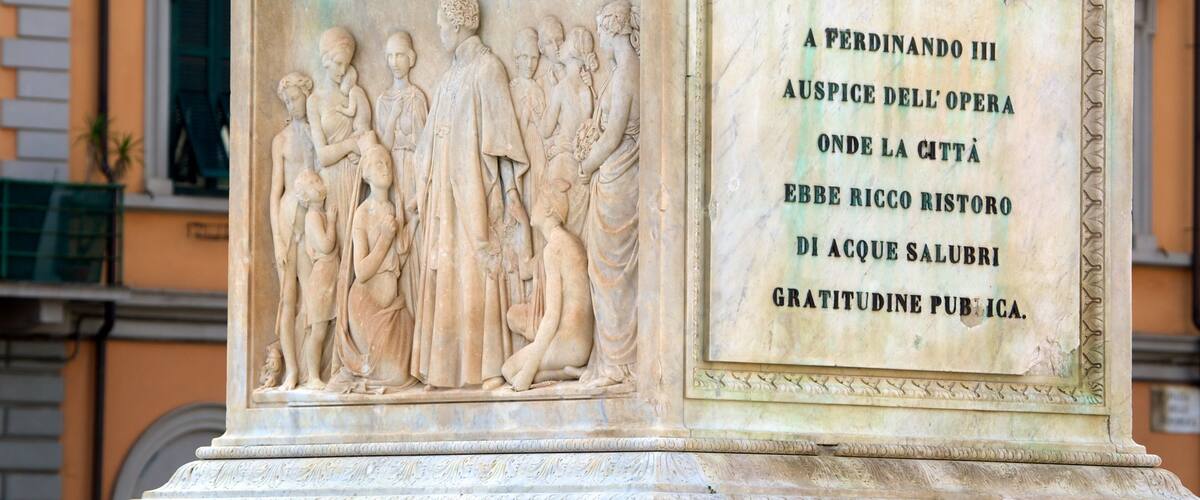 Piazza della Repubblica which includes signage, outdoor art and a monument