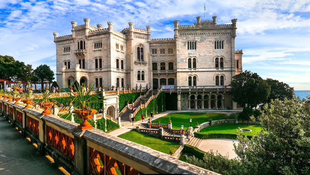 elegant Miramare Castle and its historic park on the Adriatic coast, Trieste, Italy. XIX Century white palace by the sea.