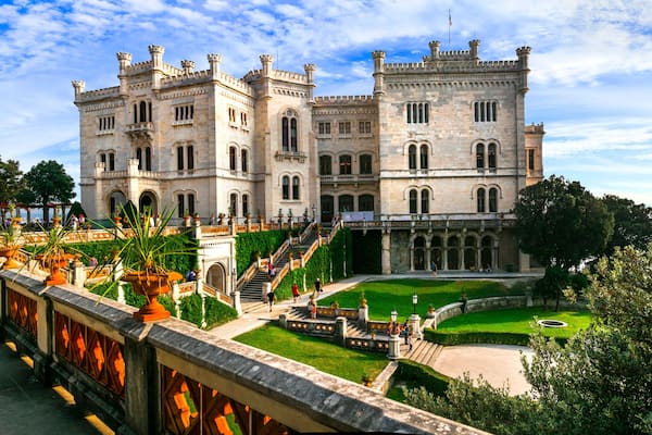 elegant Miramare Castle and its historic park on the Adriatic coast, Trieste, Italy. XIX Century white palace by the sea.