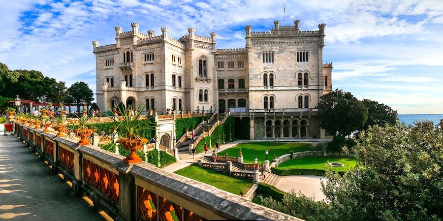 elegant Miramare Castle and its historic park on the Adriatic coast, Trieste, Italy. XIX Century white palace by the sea.