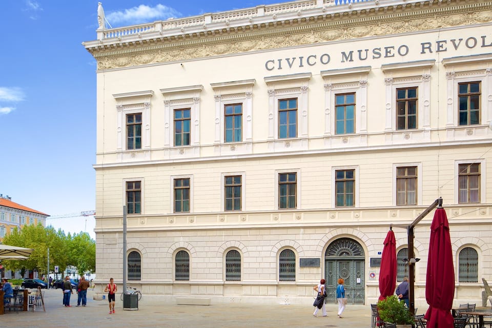 The Civico Museo Revoltello building with its classical architecture and arched windows.