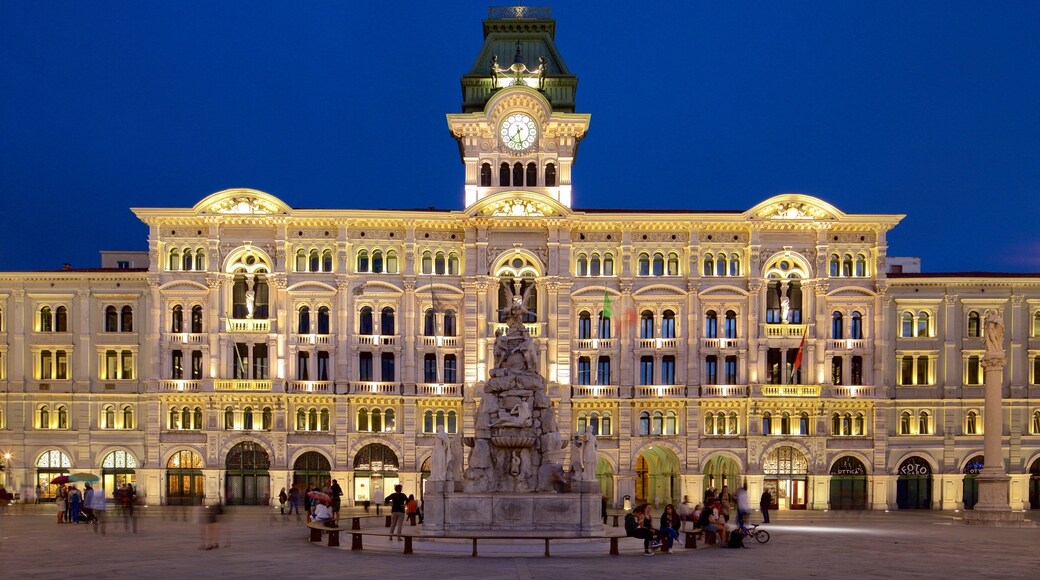 Palazzo del Municipio which includes night scenes, heritage architecture and a statue or sculpture