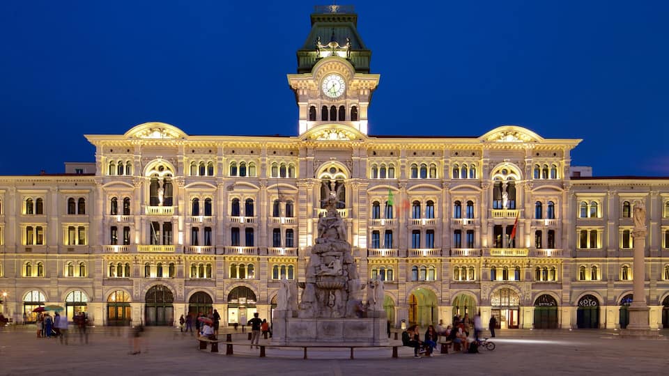 Palazzo del Municipio showing a square or plaza, night scenes and heritage architecture