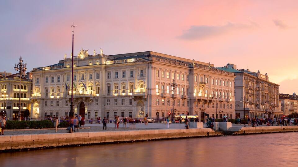 Piazza dell\'Unita which includes a sunset, general coastal views and heritage architecture