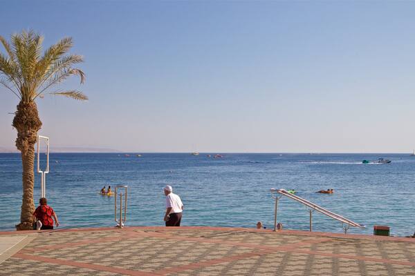 Green Beach which includes general coastal views as well as a small group of people