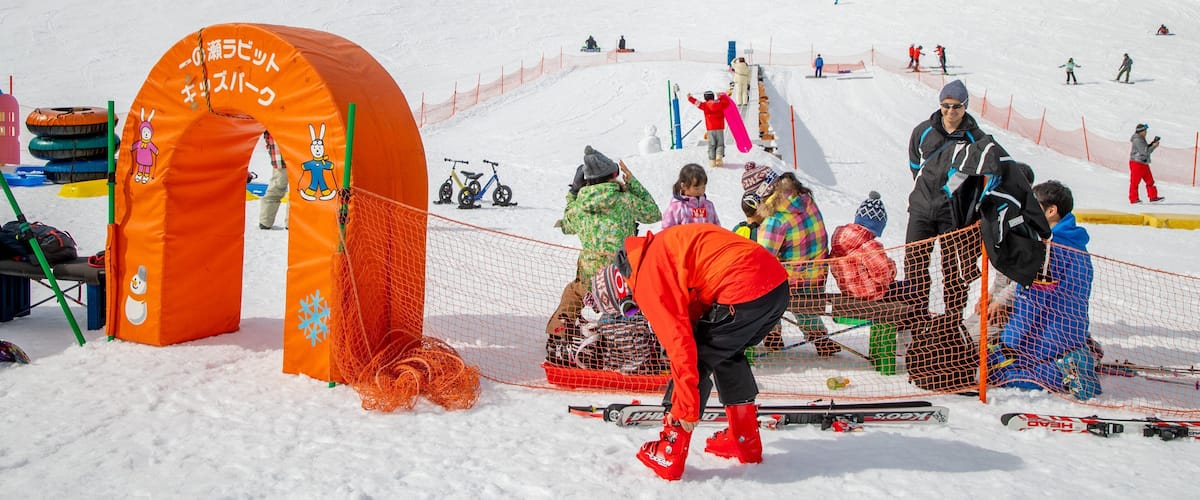 Shiga Kogen Ski Area featuring mountains and snow as well as a small group of people