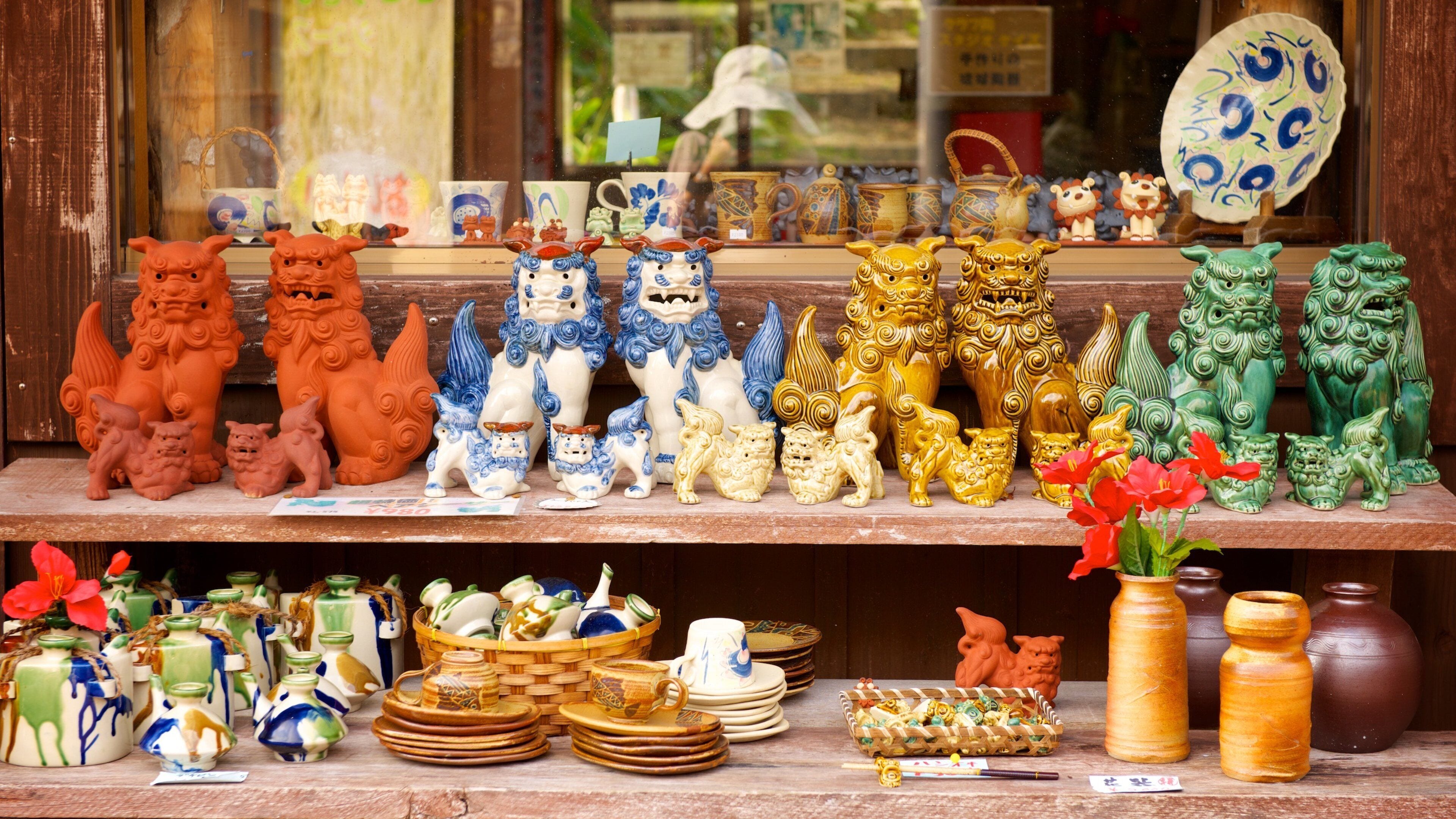 A variety of colorful ceramic figurines and pottery on display.