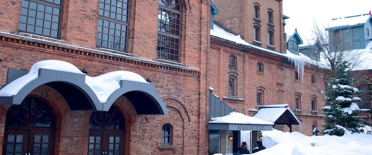 Sapporo Beer Museum which includes heritage architecture, a city and snow